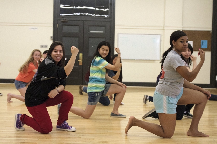 Krystal Arroyo '13 (left, red pants) and prefrosh Kianna Jackson work on a routine at a Hip Hop Dance Class in the DuPont Gymnasium.