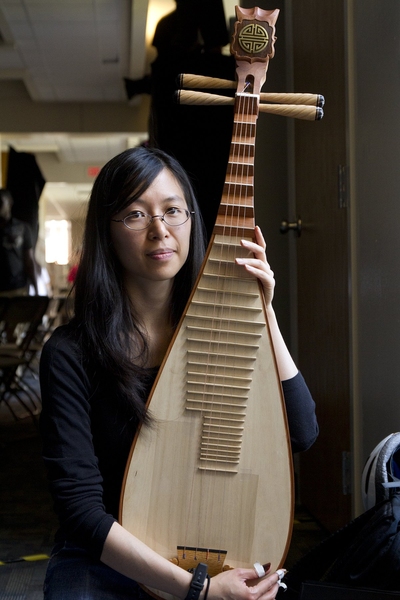 Annie Wang '04, MEng '04, PhD '11, from the MIT Chinese Ensemble, holds her pipa, a traditional Chinese four-string lutes, as she prepares for a talent show at Next House.