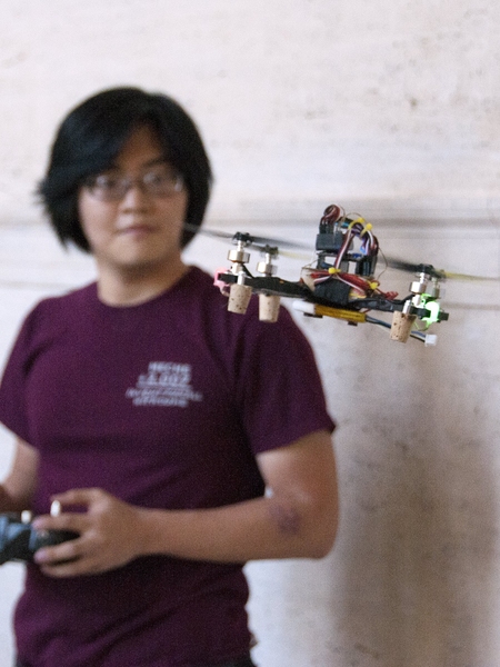 Graduate student Charles Guan, a member of the MIT Electronic Research Society (MITERS), flies a mini-copter in Lobby 7. MITERS is a student group that describes itself as a 'build-anything-you-want' club.
