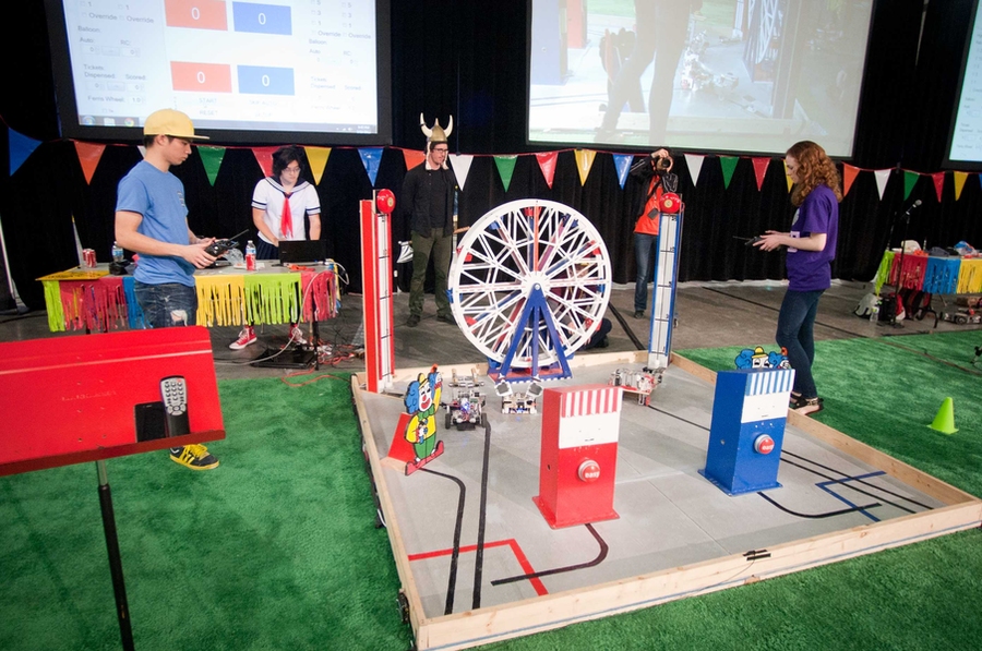 Sophomore Kawin Surakitvoborn (at left) and senior Sarah Southerland (right) compete in the final moments of the final round, each attempting to score points on the strength-test device.
