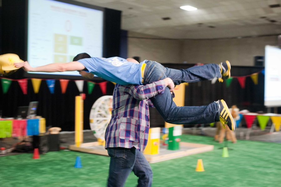 Following a longstanding tradition, Frey carries the winner around the competition field.
