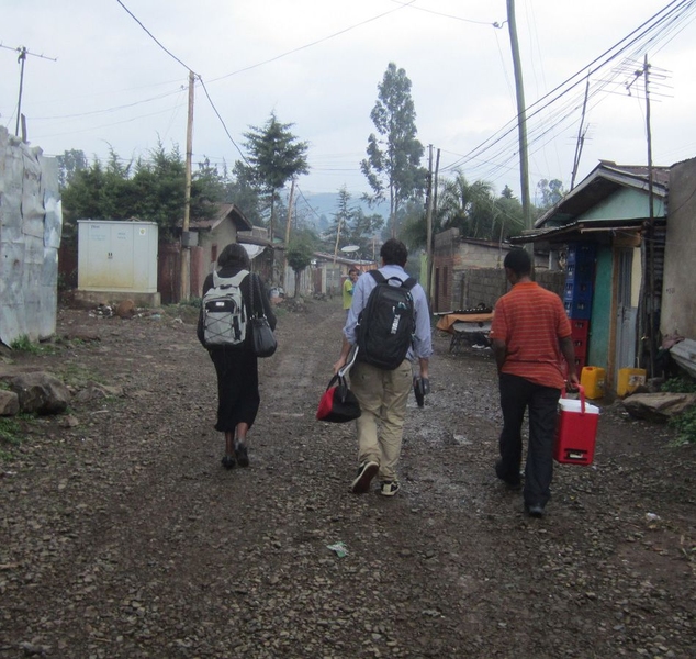 Jose Gomez-Marquez (center) and members of the CoolComply team in Addis Ababa deliver a device to be installed in the home of a TB patient.