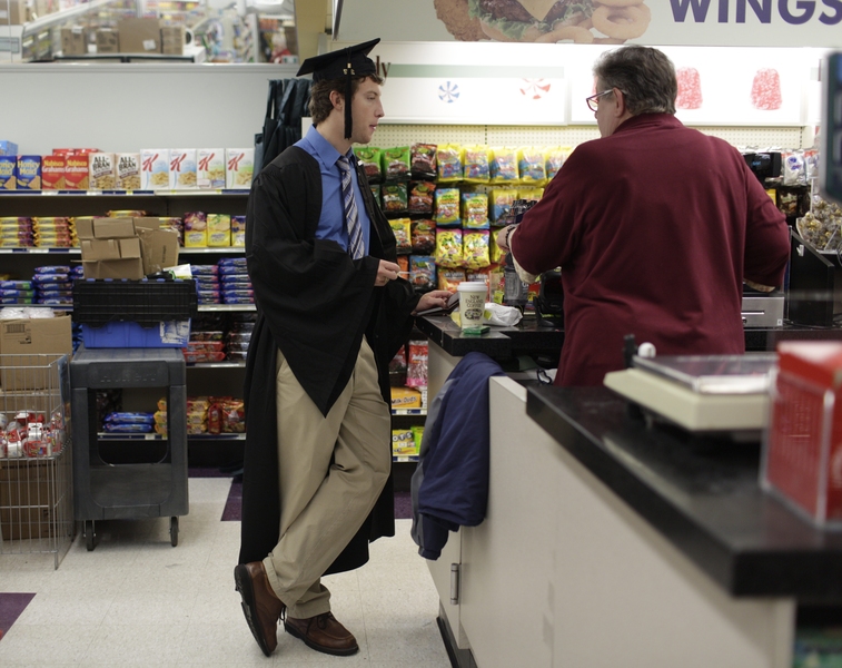 A student grabs some coffee at the Student Center before the ceremony begins.