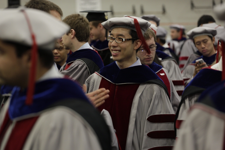 Doctoral students line up in preparation to march to Killian Court.