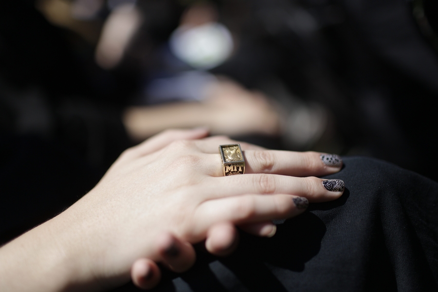 A student wears her Brass Rat, MIT's class ring.