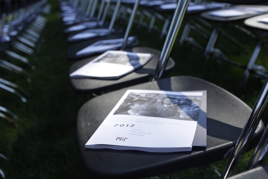 Programs for MIT's 146th Commencement sit on chairs prior to the graduates' entrance into Killian Court.