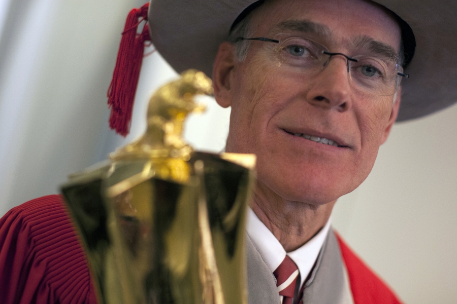 R. Gregory Turner, president of MIT's Alumni Association, holds the ceremonial mace, which is adorned with a beaver — the Institute's mascot — on top.