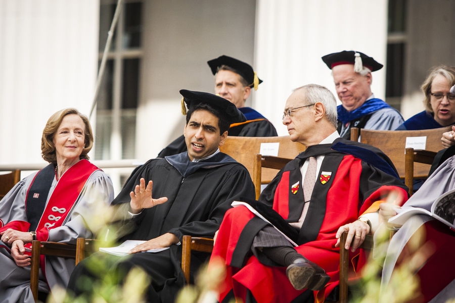 Commencement speaker Sal Khan, middle, speaks with Provost and President-elect L. Rafael Reif, while President Susan Hockfield listens.