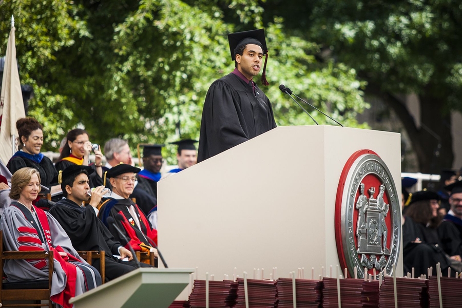 Alex Evans, president of the Graduate Student Council, delivers his address to the graduating students.