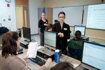 Dr. Lourdes Alemán (in front) and Dr. Alison Brauneis at Malden High School.