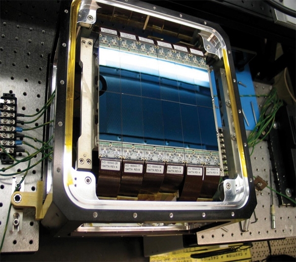 The wide field-of-view CCD in the integration test lab at Lincoln Laboratory. Note the curvature of the image of a fluorescent bulb at the top of the unit.