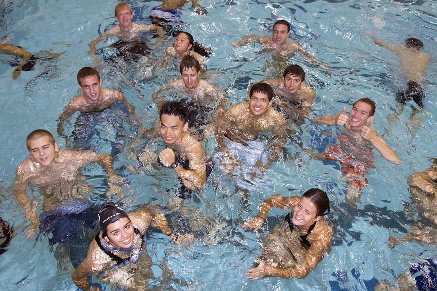 A crowd of students take on the 'boat test,' an optional test that involves treading water continuously for 10 minutes after finishing the 100 yard swim. The boat test is required by the sailing pavilion and boathouse in order to use sailboats or crew shells.