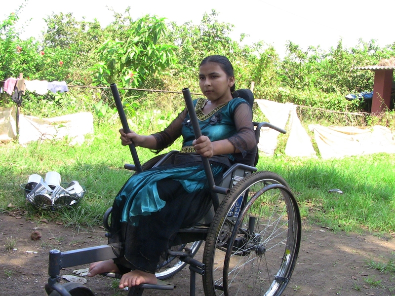 An Indian woman tests the Leveraged Freedom Chair (LFC) outside of Mumbai during the field trial in India. In 2007, Amos Winter SM '05 PhD '11, assistant professor of mechanical engineering, introduced the D-Lab class Wheelchair Design in Developing Countries (EC.721). In 2008, Winter and his team developed the LFC; its design has evolved with field trials in East Africa, Guatemala and Ind...