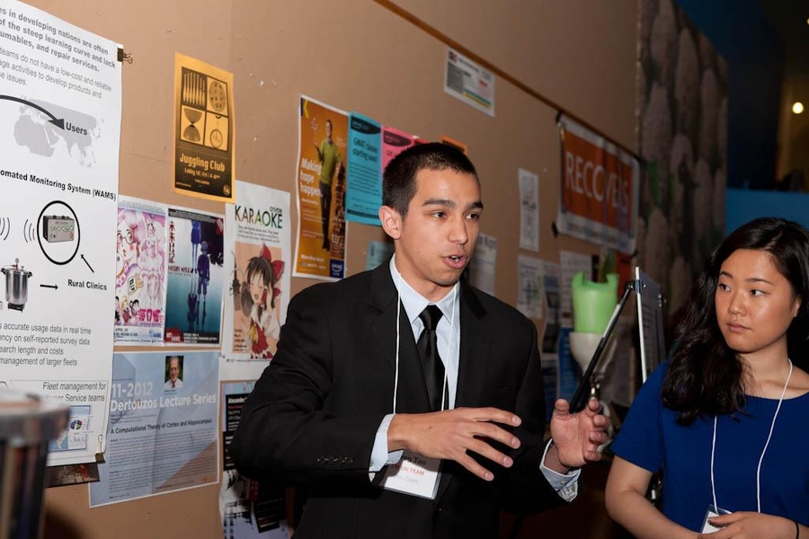 Tao presents to judges at the IDEAS Global Challenge judging session, as teammate Hallie Sue Cho '10, SM '12 looks on.