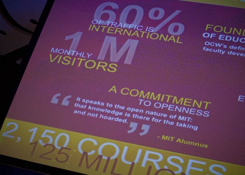 A slide displays statistics about OCW.