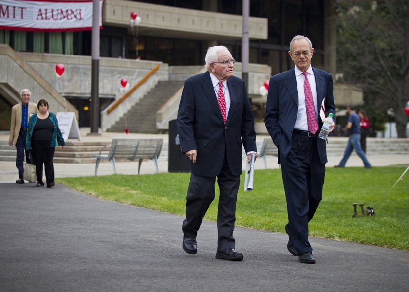 MIT's 17th President, L. Rafael Reif, right, walks with MIT's 14th President, Paul Gray '54, SM '55, ScD '60, into the Inauguration symposium on 'The Future of Education.'