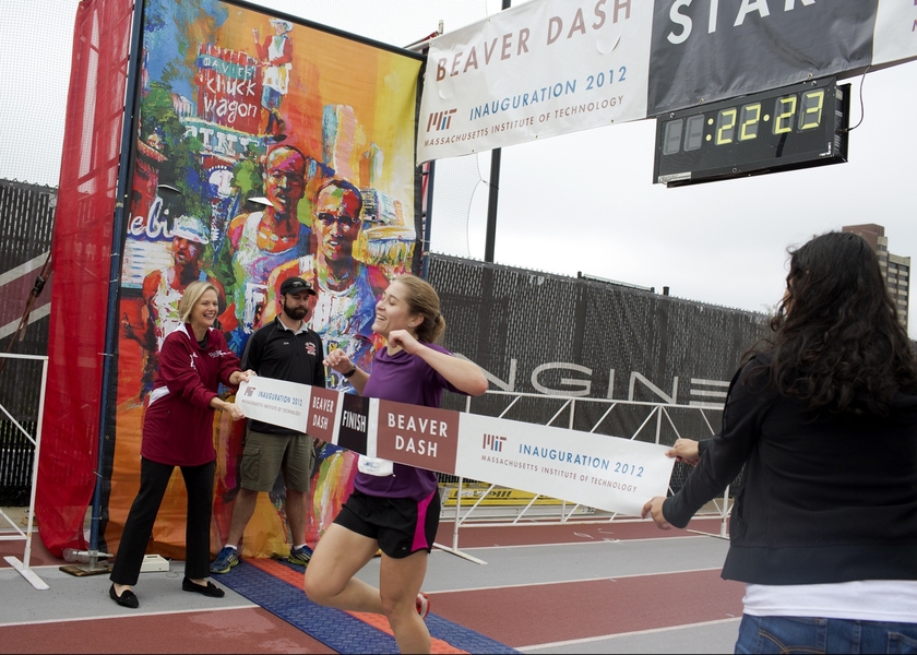 The president's wife, Christine, was on hand to hold the tape as the lead female runner, Claire Derosa, finished the race.