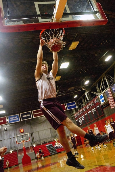 Sophomore guard Nick Prus throws down a dunk. The men's team opens its season on Nov. 9 with an exhibition game against Harvard University. The women get their season rolling at the Salem State Tip Off tournament on Nov. 17.