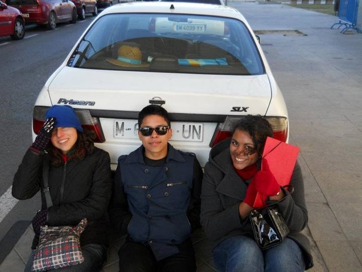 During a tour through the campus of Universidad Complutense de Madrid, Sara Comis, Saul Lopez, and Elise Myers huddled behind a parked car for shelter from the fiercely cold wind.