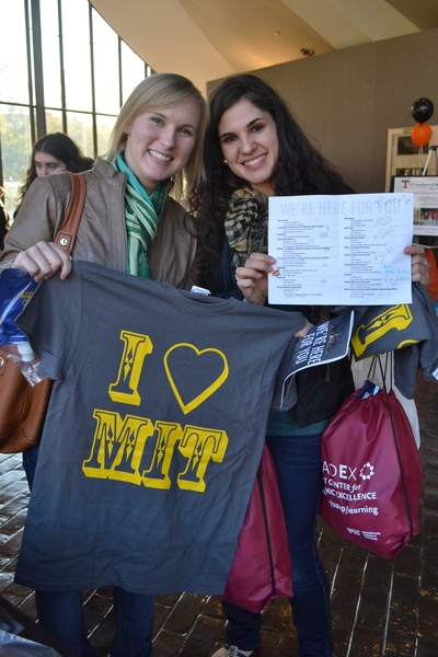 The Wellness Fair featured 'passports' that listed organizations and resources across MIT, as well as their websites and contact information. Students earned a water bottle if they visited half of the tables at the event and earned a T-shirt if they visited all the tables. Emily Hupf '14 (left) and Noa Ghersin '14 (right) were two of the first students to fill their passports and w...