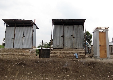 The Sanergy toilet, far right, next to existing toilets at Bridge International Academy school in the Lunga Lunga slum of Nairobi.