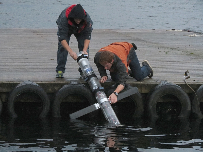 Adrian Tanner and Tommy Moriarty take the glider out of the water at the dock of the Narrows Inn/Marina in Ketchikan, Alaska.