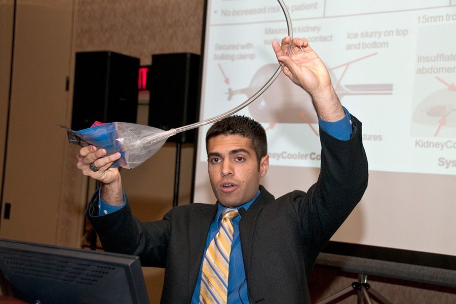 Thomas Cervantes, a student from the Precision Machine Design class, demonstrates a prototype kidney-cooling device at the Design of Medical Devices conference in Minneapolis, Minn., in 2011.