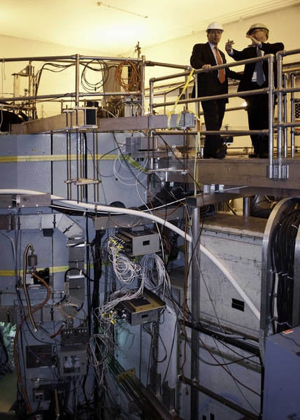 Udall gets a birds-eye view of the Alcator C-Mod cell from atop the tokamak, with project head Earl Marmar.