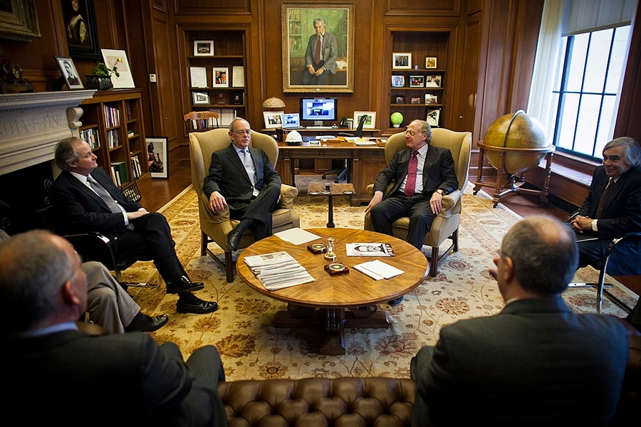 (Clockwise from center left): MIT President L. Rafael Reif, Eni CEO Paolo Scaroni and MITEI Director Ernest Moniz met in Reif's office, along with other officials of Eni and MIT, prior to the signing of Eni's renewed partnership with MIT.