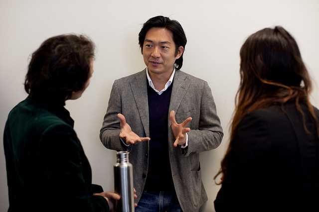 Scaling Development Ventures panelist Toshi Nakamura, co-founder of Kopernik, talks with conference participants.