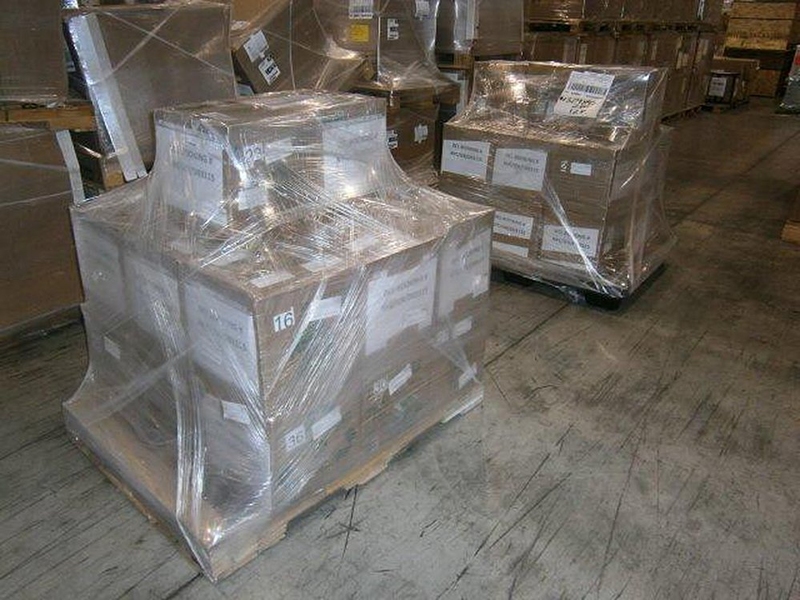 The two pallets of donated mathematics texts, weighing in at more than 2,000 pounds, await further processing in a shipping warehouse.