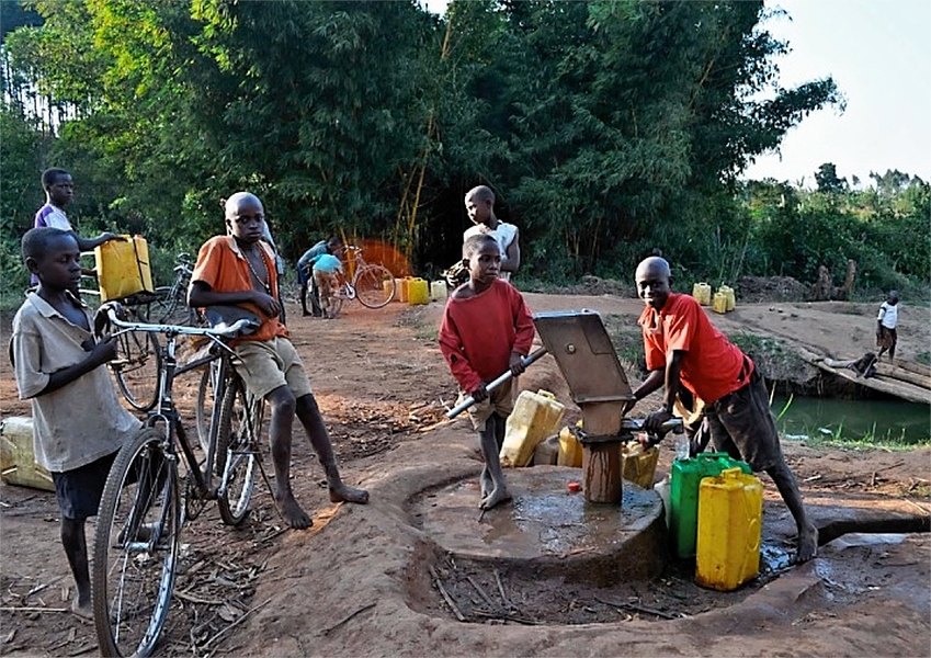 Children collect water in Ddegeya, Uganda.

