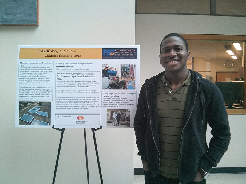 Ezeozue poses at a seed grant poster presentation for his company, SolarKobo, at the Legatum Center.