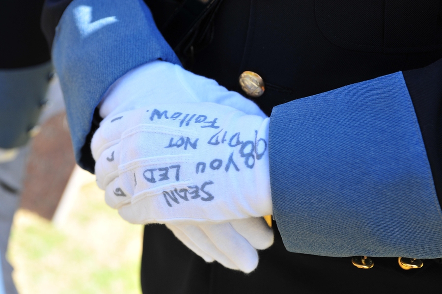An officer wrote a message to Collier on his gloves, which were later placed on Collier's casket. 