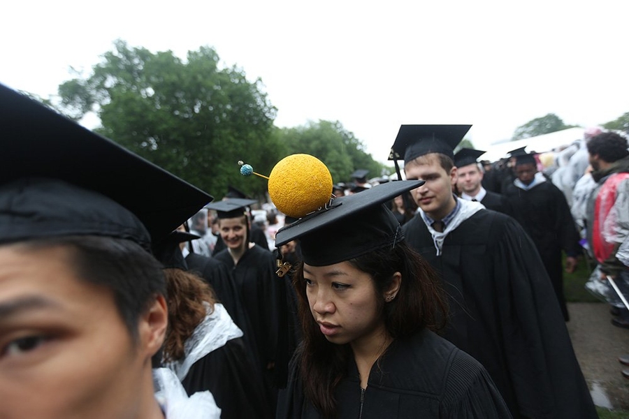One graduate adorned her mortarboard with the sun, which was missing from Friday's ceremony.