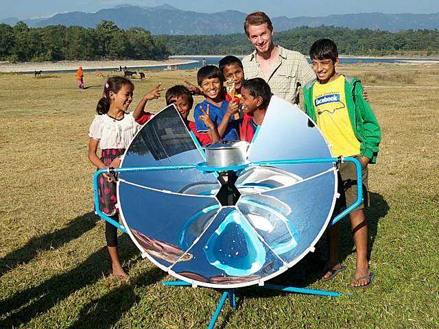 Scot Frank with villagers from the Terai region of Southwest Nepal, where he demonstrated the SolSource by cooking a four-course meal.