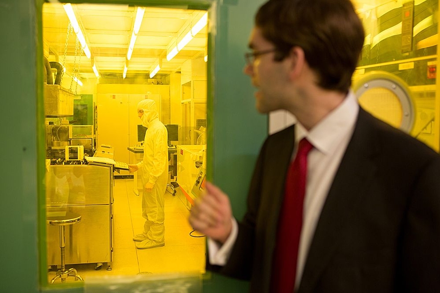 Tomás Palacios peers into the Microsystems Technology Laboratory (MTL) clean room where his record-setting gallium nitride transistors were manufactured.