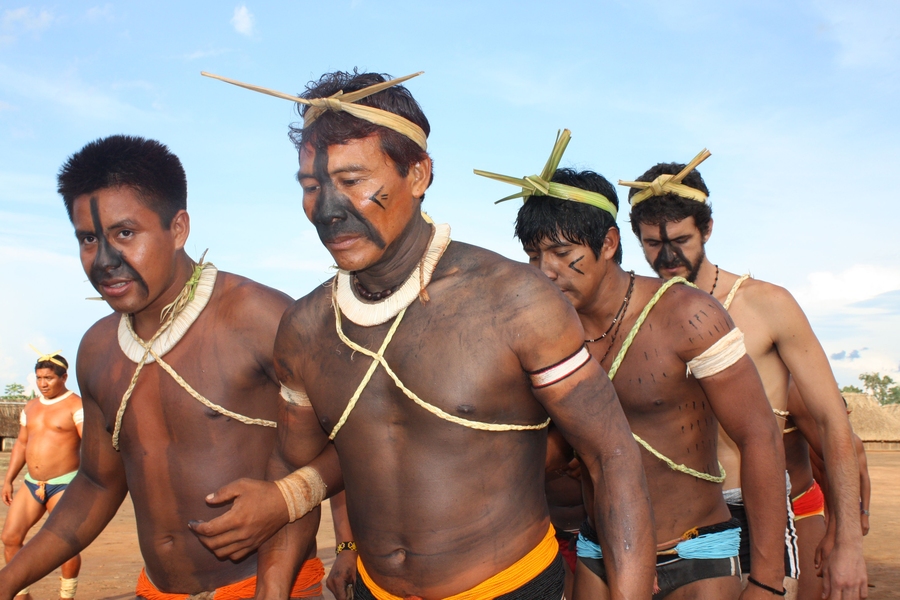 Nonato and native Brazilians participate in a rat ceremony, a celebration where men sing for their female relatives. 
