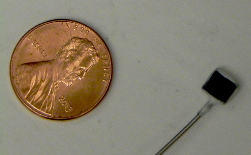 Thin film sample for electrocalalytic testing is smaller than a penny.