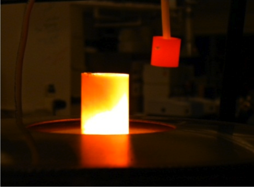 A silicon carbide (SiC) sample is removed from a 1500 degree C. furnace, where it demonstrated superior tolerance to oxidation with steam.
