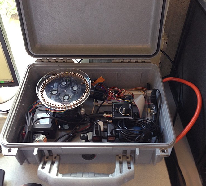 Chemical engineering graduate student Nigel Reuel has spent much ofthis year adapting his nanosensors to mobile measurement, building thisbriefcase-sized detector system that can measure real-time binding kinetics of 20 to 50different biological samples. The device will be tested at Novartis laterthis year.
