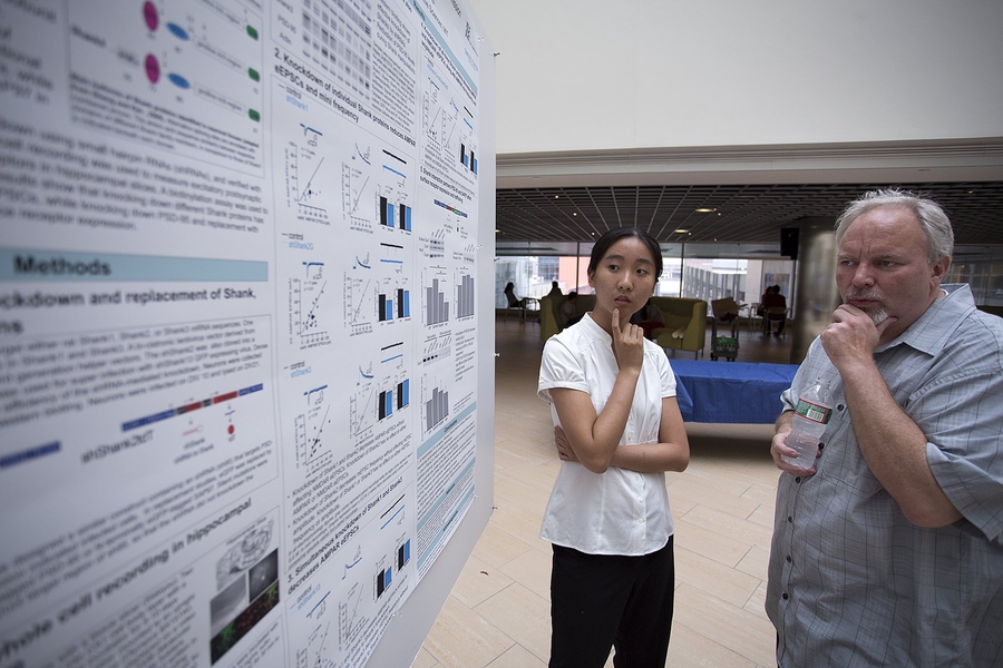 Rebecca Shi '16 discussed her research with Troy Littleton, an MIT professor of biology and an investigator in the Simons Center. "In some sense, it's an obligation we all have to train the next generation and have these kinds of opportunities to allow students to figure out that they like doing science," Littleton said.
