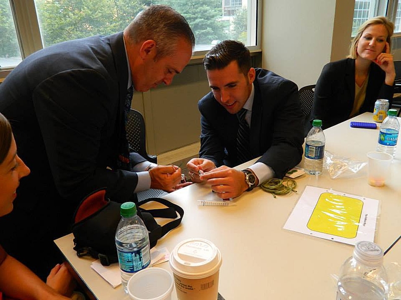 Malone (left) joined the hands-on BioBuilder activity.