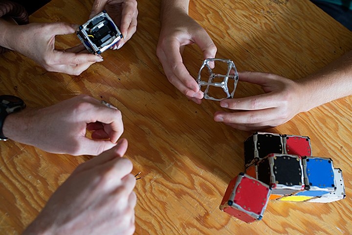 The researchers discuss the design of the next generation of M-Cube prototypes.
