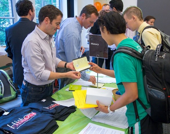 Associate Professor of History Christopher Capozzola meets with students at the expo.
