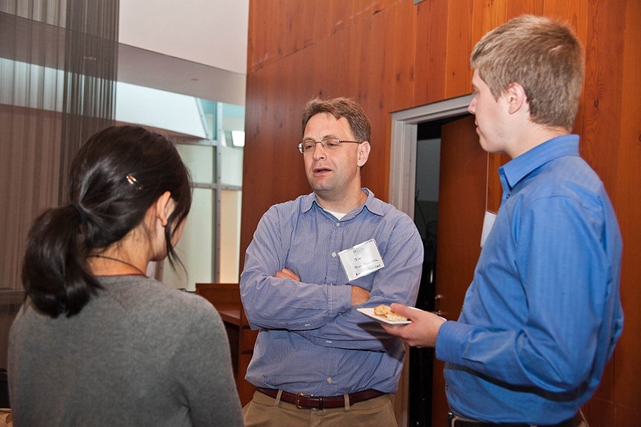SuperUROP students Erika Ye (back to camera) and Neil Fitzgerald talked with Jim Fiorenza of Analog Devices.