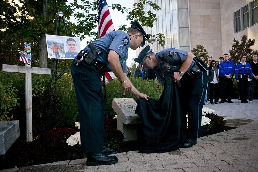 MIT Police officers unveil the new memorial to Officer Sean Collier.