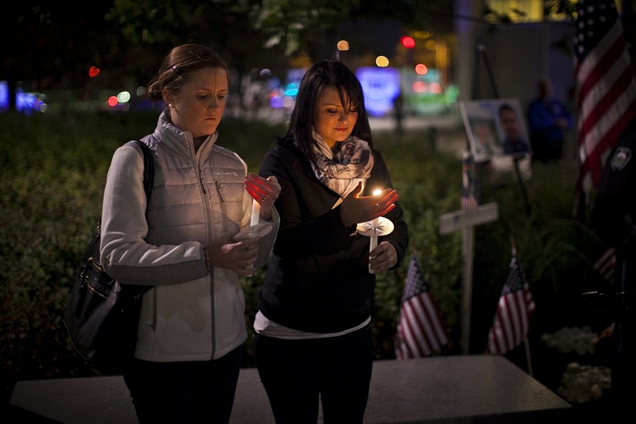 Officer Sean Collier’s sisters held the candles from which all others were lit.