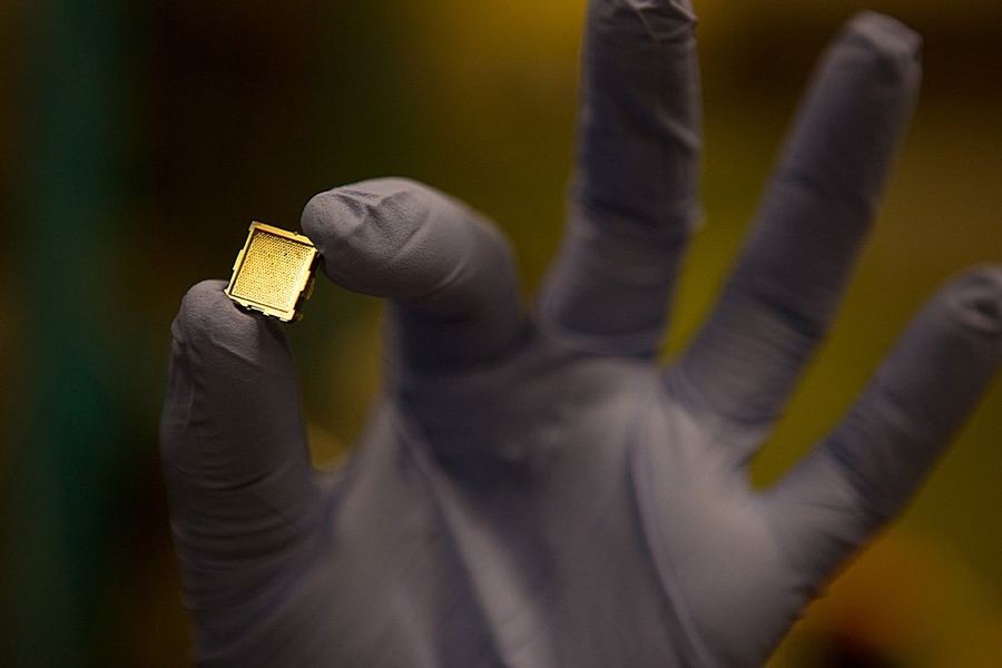 Lozano holds a prototype of a microthruster, developed to propel small satellites in space.