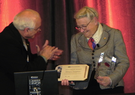 Dresselhaus receives the von Hippel award from Materials Research Society President Orlando Auciello, of the University of Texas at Dallas, during the MRS fall meeting in Boston. The award includes a crystal trophy and cash prize. 